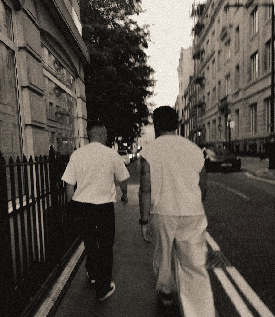 Elliot L. Stopford and Zach Loera walking through the city